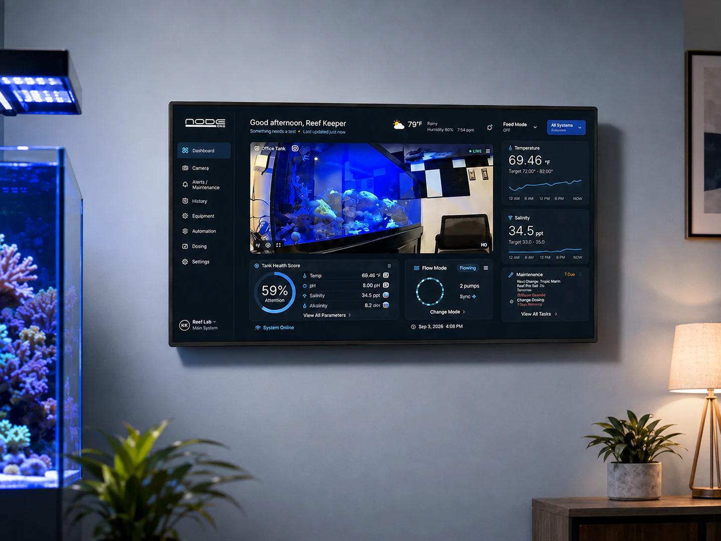 Orca 27-inch Node One aquarium dashboard beside a reef tank